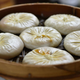 soup dumplings in bamboo steamer